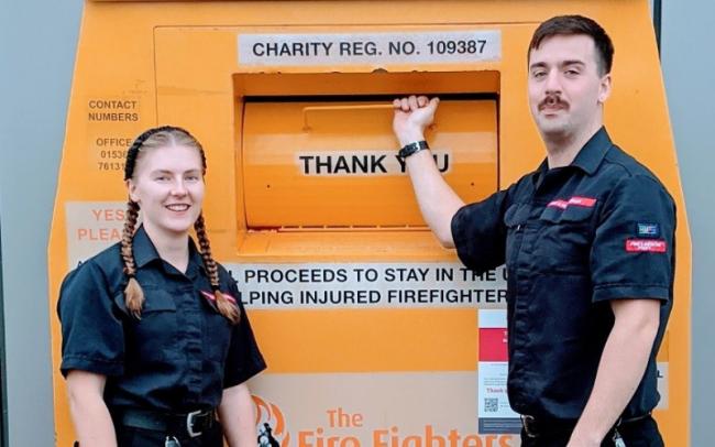 Firefighters Charlotte Jennings and Michael Hooper are pictured at the HWFRS recycling bank at Evesham (Picture: HWFRS).