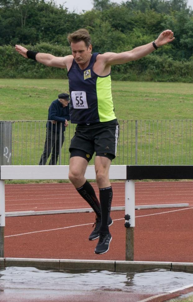 Worcester News: Mike Lambert competing in an athletics event. 