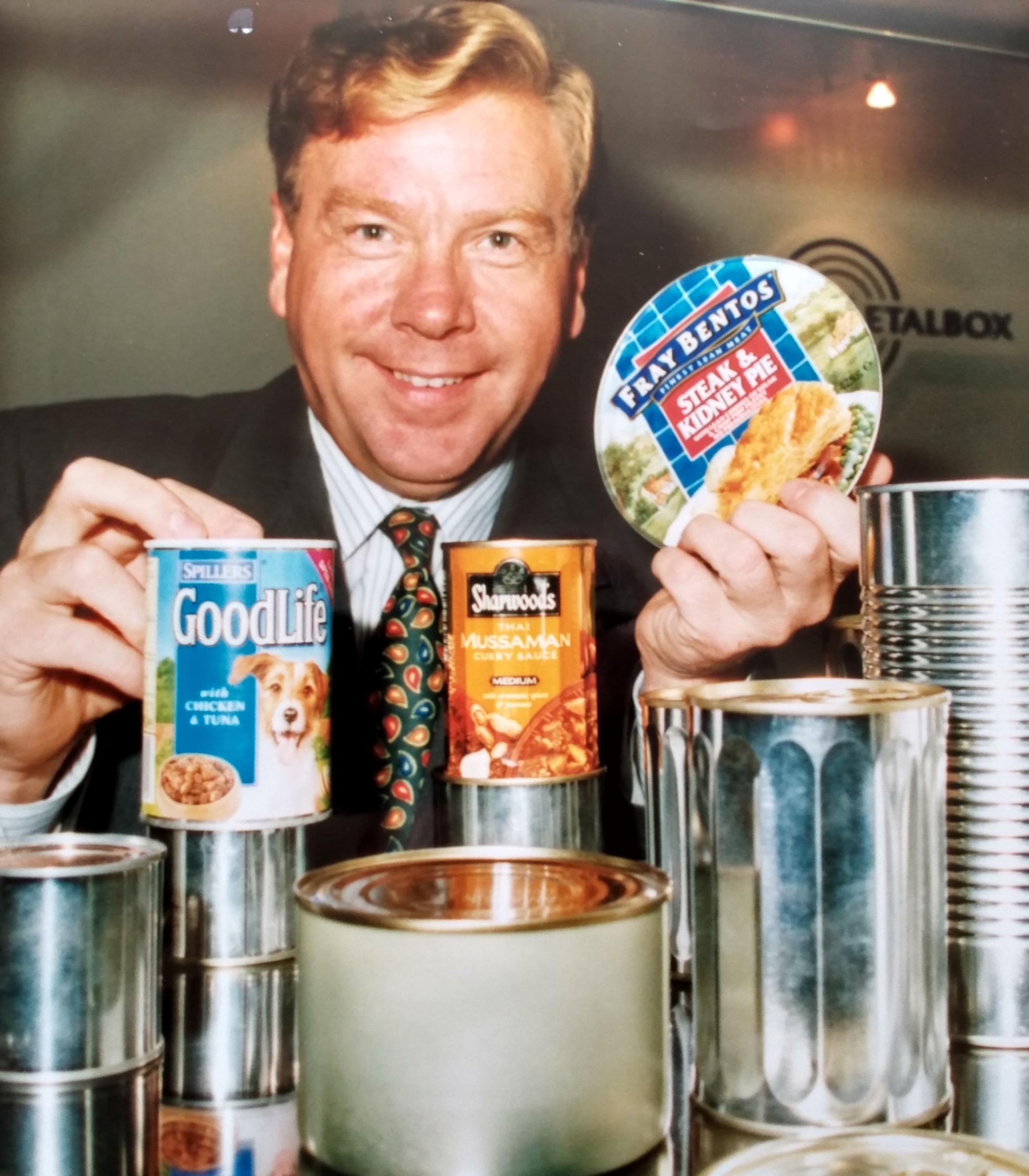 CarnaudMetalbox marketing director Nick Mullen with the winning cans in the MPMA Best in Metal contest in October 1994