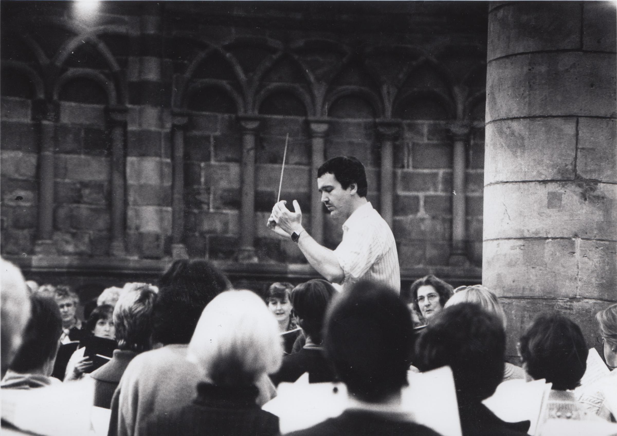 Conductor Adrian Lucas leads a rehearsal in 1997. Image Conrad S Rowberry