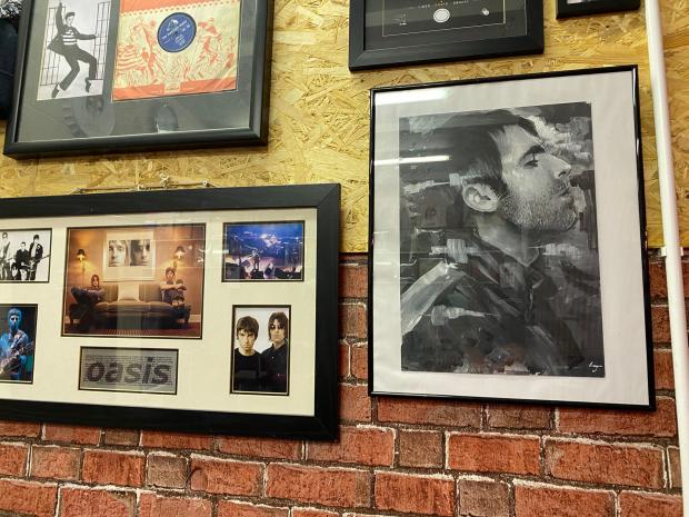 Worcester News: Artwork of Liam Gallagher in the pub 