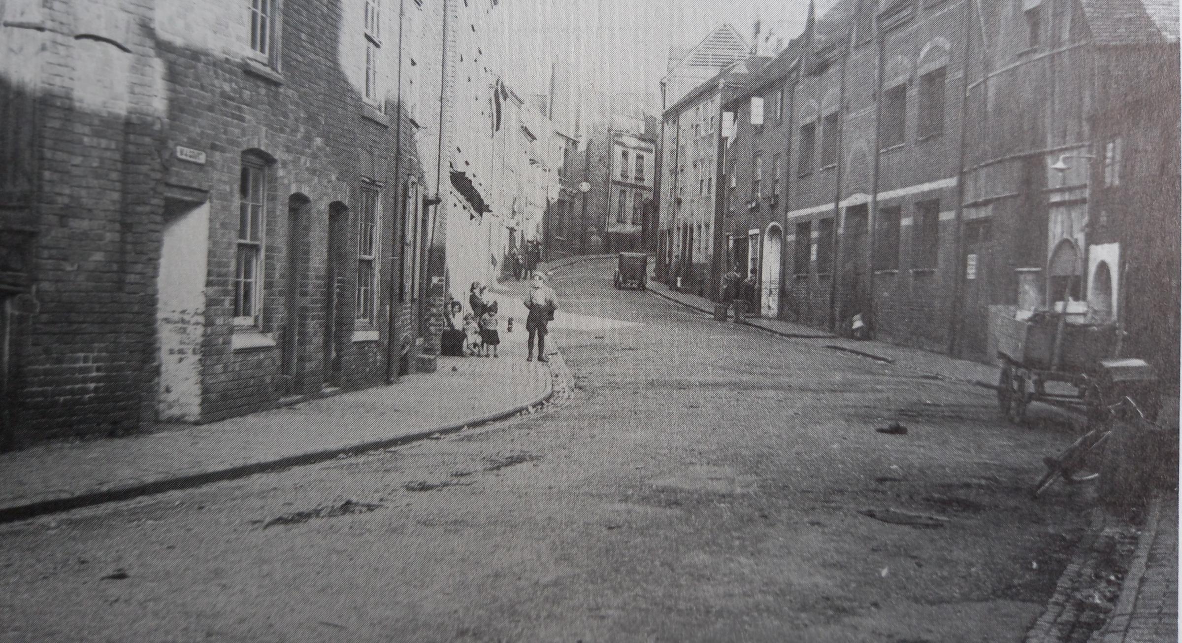 In 1931 AD McQuirk was commissioned by the Department of Public Health to take a series of images of the slum area of Dolday as part of a collection of Worcester’s vanishing streets This is looking up the road towards Broad Street