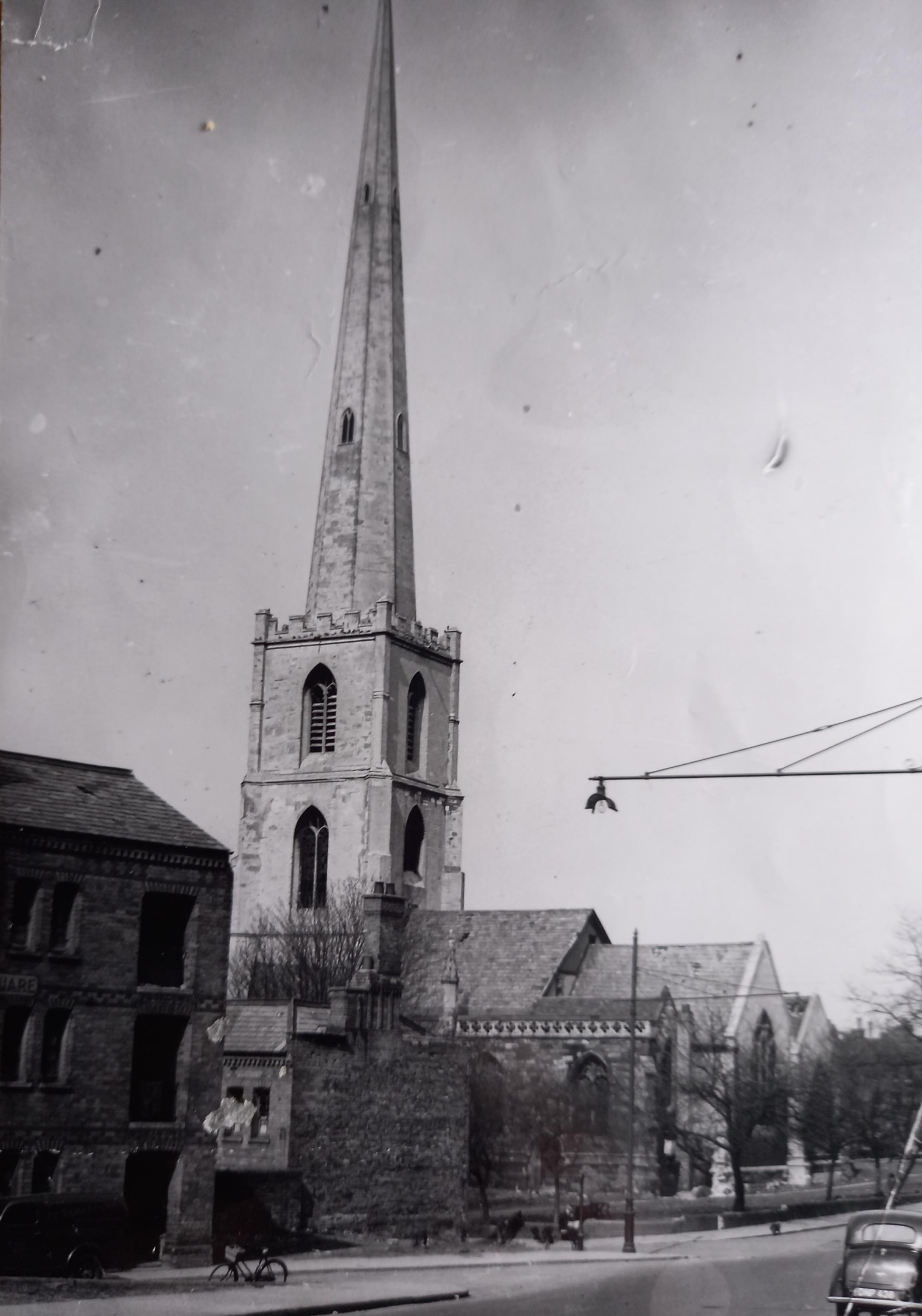 St Andrew’s Church and spire on Deansway The spire remains, but the church was demolished in 1949. There had been access through the church grounds to the smugglers’ cave