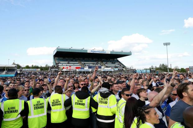 Fans invaded the pitch at Bristol Rovers' final League Two match of the season against Scunthorpe