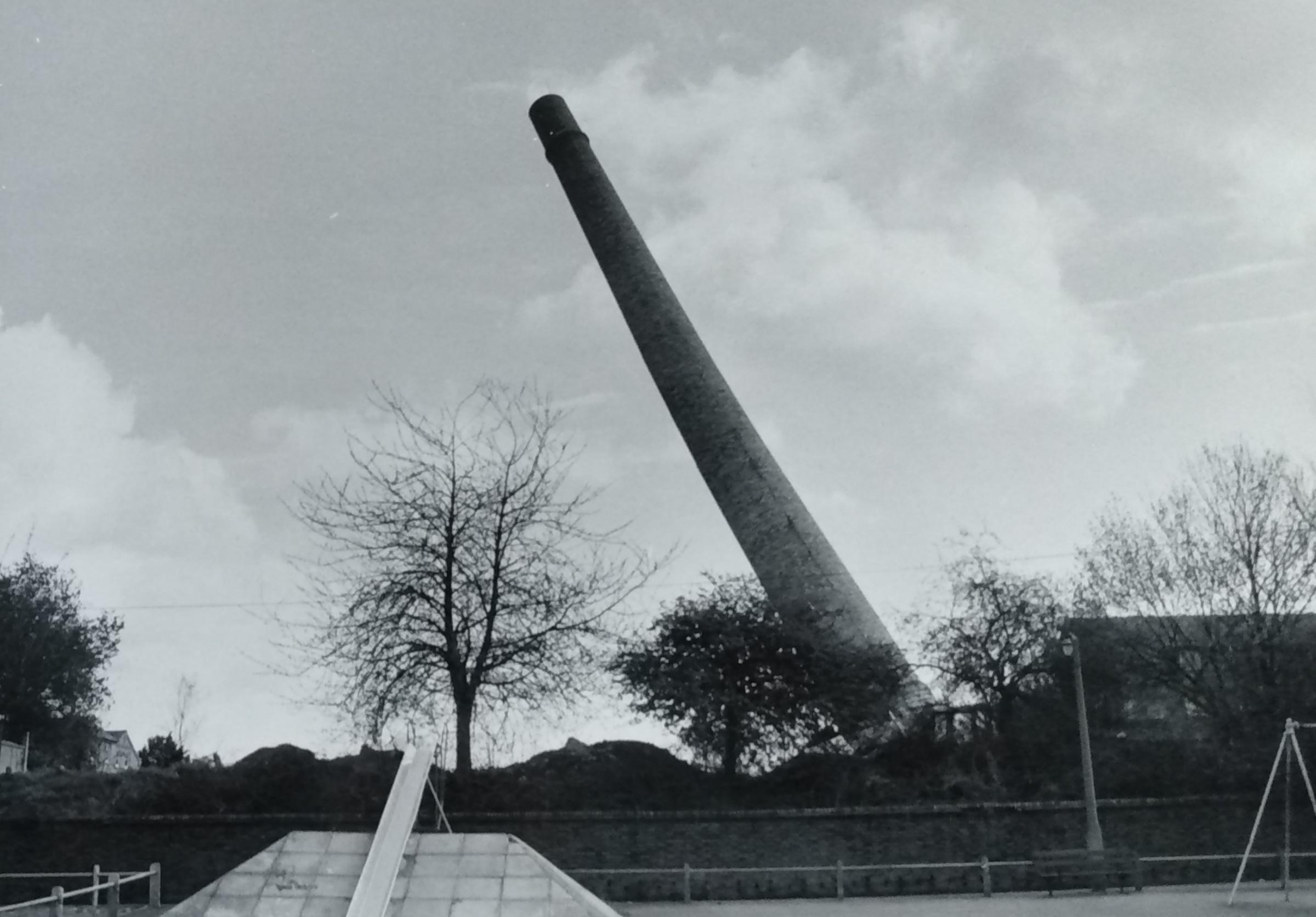 The former hospital chimney comes down in April 1987 as the former Hillborough site is flattened to make way for new housing