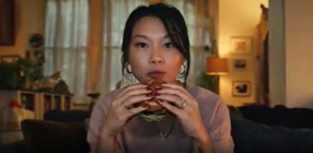 Worcester News: A shot from the now banned Tesco advert of a woman eating a burger (Tesco/PA)