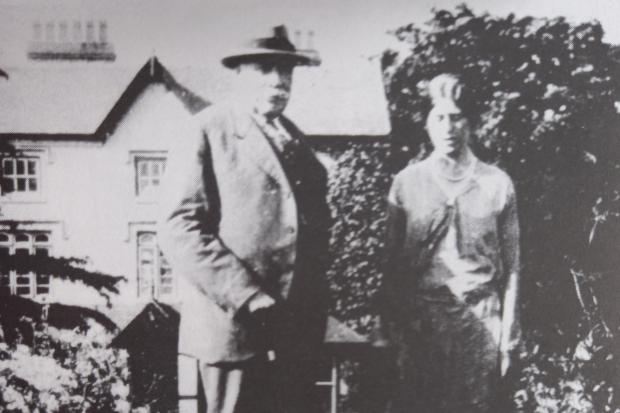Elgar and his daughter Caris, plus pet dogs, in the gardens of Marl Bank