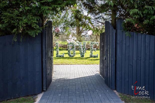 Worcester News: The garden is hidden behind its own gates. Credit: The Holt Fleet/Time Lock Photography