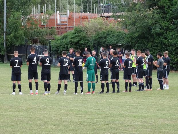 Worcester News: Ledbury's current first team take part in a minute's applause for Robert Davis