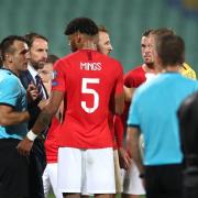 STOPPAGE: Match referee Ivan Bebek speaks to England manager Gareth Southgate and Tyrone Mings. PA