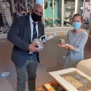 Cllr Jabba Riaz and collections officer Louise Price previewing porcelain and design archive influenced by Arts of Islam