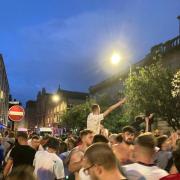 CROWDS: Drunken football fans celebrated the win in The Cross