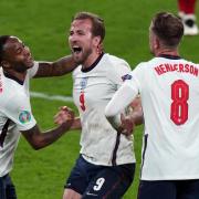Raheem Sterling, Harry Kane and Jordan Henderson celebrate after beating Denmark 2-1 at the Euro 2020 semi-finals.