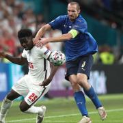 Italy’s Giorgio Chiellini pulls back England’s Bukayo Saka during the Euro2020 final (PA)