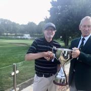 Captain Graham Whitehead (right) presents the Seniors Club Championship trophy to Steve Kirby (left) at the Vale.