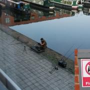 ILLEGAL: The angler illegally fishing in Diglis Basin