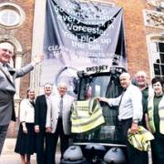 BIG MESSAGE: Mayor of Worcester Mike Layland unveils a banner outside the Guildhall, watched by, from left, Georgia Smith, Coun Simon Geraghty, Coun Roger Knight, Malcolm Cox, Carl Day, Brenda Francis, Mike Harrison and Robert Maggs. 27040101