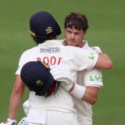 Sam Northeast of Glamorgan celebrates his century with Billy Root.