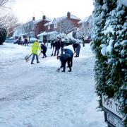 COMMUNITY SPIRIT: A team of about 20 people helped to clear the snow in Maytree Hill in Droitwich (Picture by reader Rachael Moore)