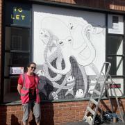 Helen Haynes with her mural during last year's festival