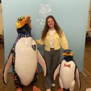 Artist Jess Perrin with penguins Spirit and Hoiho