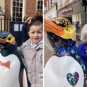 MAGIC: Ollyver-James Calder and Ann Fitzgerald could not resist a hug with the 'Waddle of Worcester' penguins to raise money for St Richard's Hospice