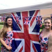 Lyndsey Davis (left) and Kirsty Parsons in the Union colours to mark the King's Coronation at the Broadheath Meadows party