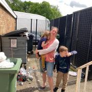 DISGUSTING: Sarah Mileham with children Sophie, four, and Matthew. seven, have been left holding their noses over fly-tipping in their communal bins at flats in Cranham Drive
