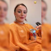 BABY BUMP: Cher Lloyd using her bump as a table while pregnant with Eliza Violet who is showing signs of following in her musical mum's footsteps.