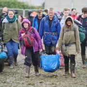 Festivalgoers brave the wet conditions at a previous Glastonbury Festival.