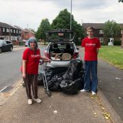 ACTION: Jill Desayrah (left) and Jack Walker fill her car with rubbish during a Warndon litter pick