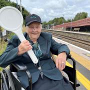 HONOUR: Rose Gardner with the dispatch baton dispatching a train from Honeybourne to Worcester Shrub Hill
