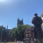 VERTIGO: Sir Edward Elgar's statue gazes out towards the scaffolding which covers one side of Worcester Cathedral, all the way to the top