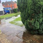SCARY: Water is pouring into their garden on Liverpool Road.