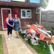 DISGUST: Anj Grey and Cllr Jill Desayrah next to the fire-damaged rubbish which has since been cleared at Sheepscombe Drive in Warndon, Worcester