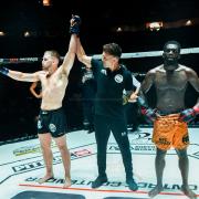 Shay Ingram has his hand raised after defeating Christian Soda in FCC35