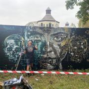 Title working on his mural in Cripplegate Park