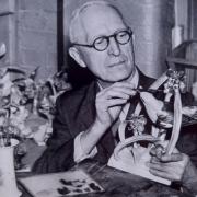 Harry Davis painting one of Dorothy Doughty's bird models.