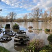 FLOODED: The gardens of the Diglis House Hotel in Worcester but the business is open including the patio which commands views of the River Severn