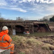 DRAMA: A boat crew check the structural integrity of Powick Old Bridge