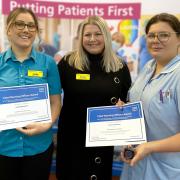 Jade Maddocks (left) and Jemma Mulrine (right) at the Healthcare Support Worker Awards after being presented their awards by Chief Nurse of Worcestershire Acute Hospitals NHS Trust, Sarah Shingler (centre)