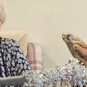 Perry Manor resident Betty Hann with one of the birds