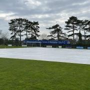The two clubs have provided their covers to help protect the Claines Lane pitch ahead of Saturday's sold-out FA Vase semi-final