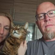 Martin Harris [RIGHT] with cat Kaiju and partner Michelle [LEFT]