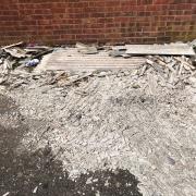 MESS: The suspected asbestos pile in Nailsworth Close in Worcester has been reported to Worcestershire Regulatory Services by Cllr Jill Desayrah