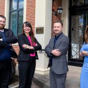 promoted: From left are mfg Solicitors' Tom Bell, Sharon Lerry, managing director Andrew Davies, and Nazia Riaz.