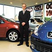 Sales executive Stuart Round at St Peter's Peugeot car dealership. Picture by Simon Rogers. 20035301