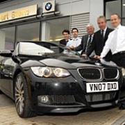 Colin Sutton, Richard Hunt, Roger Hunt, David Preece and Adrian Reed admire a BMW 35i convertible at the Robert Stern dealership in Worcester. The car will be at tomorrow's show. Picture by Martin Humby. 20035901