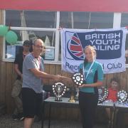 Lia Horne receives the best school team trophy on behalf of South Bromsgrove High. Picture: RYA Midlands