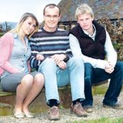 GRATEFUL: Andy Holmes’ wife Alison died of cancer. The dad of two, pictured with children Steph and Ben, is full of praise for St Richard’s. 09150401